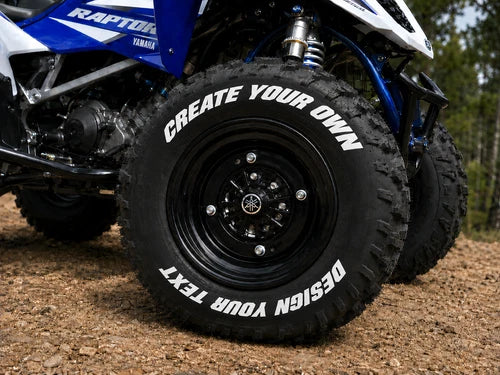 Custom Text ATV Tire Stickers shown on a tire or vehicle wheel